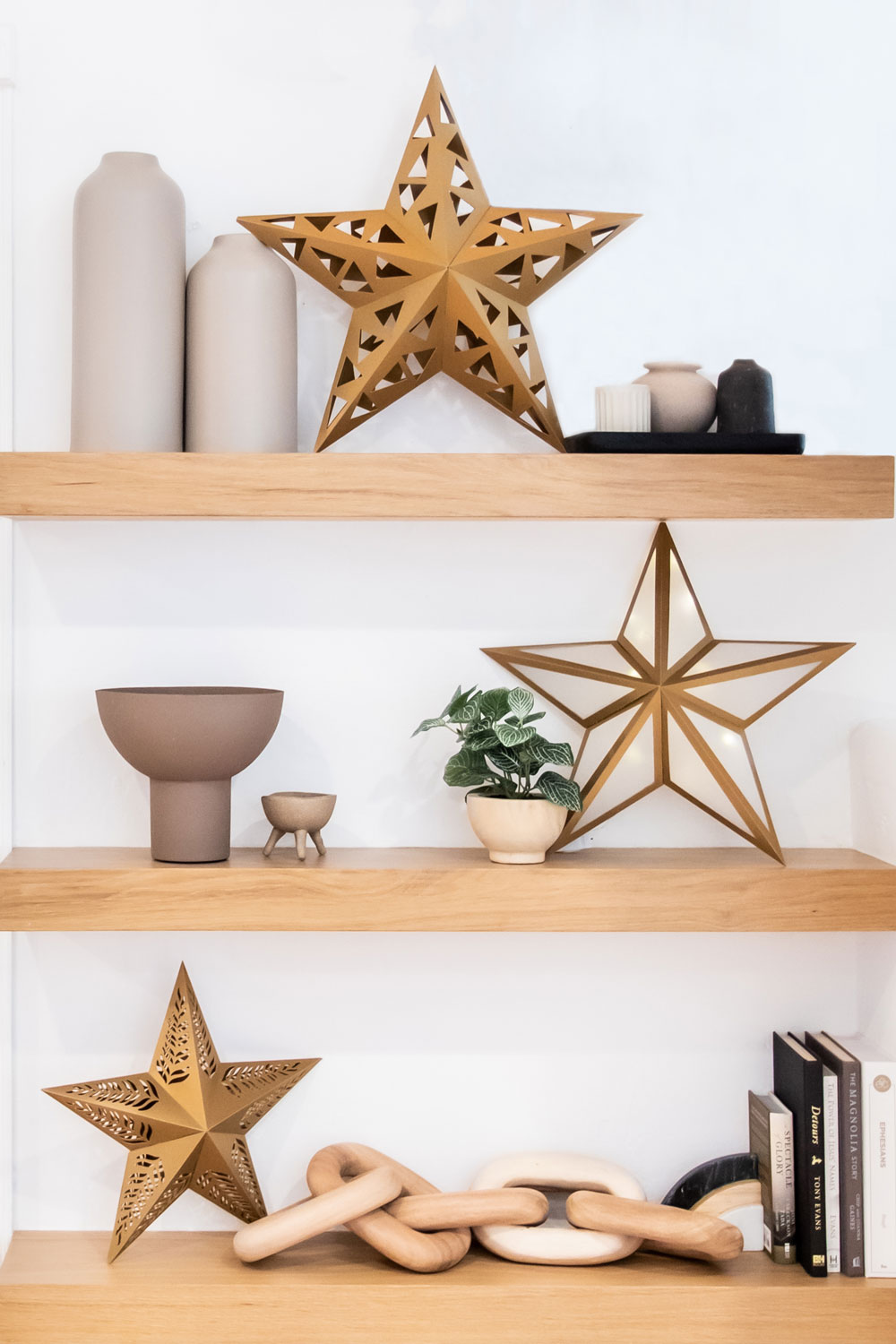 Paper star lanterns sitting on shelf