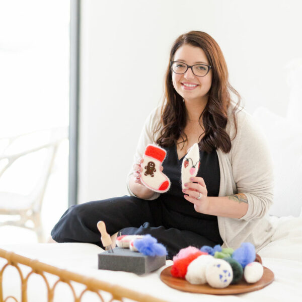 Dani Ives with holding wool felted ornaments